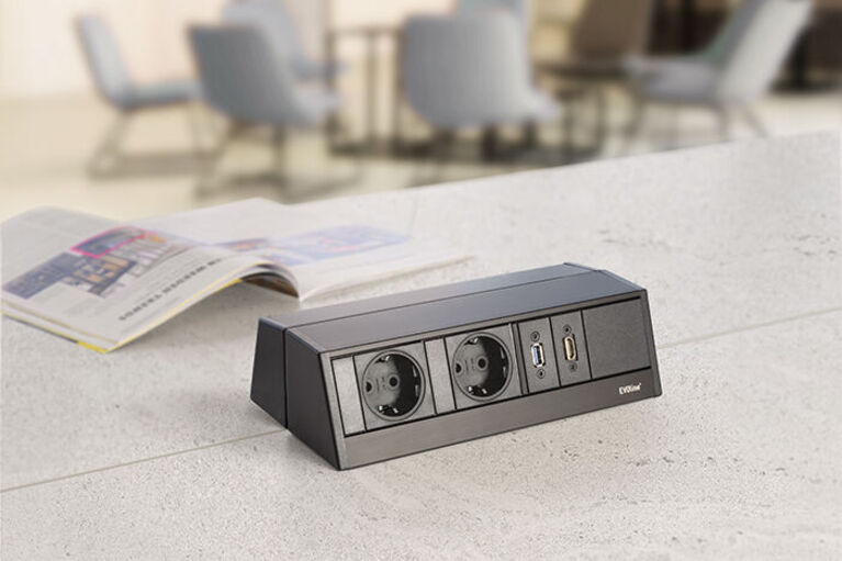 Two desk sockets back to back usable from both sides